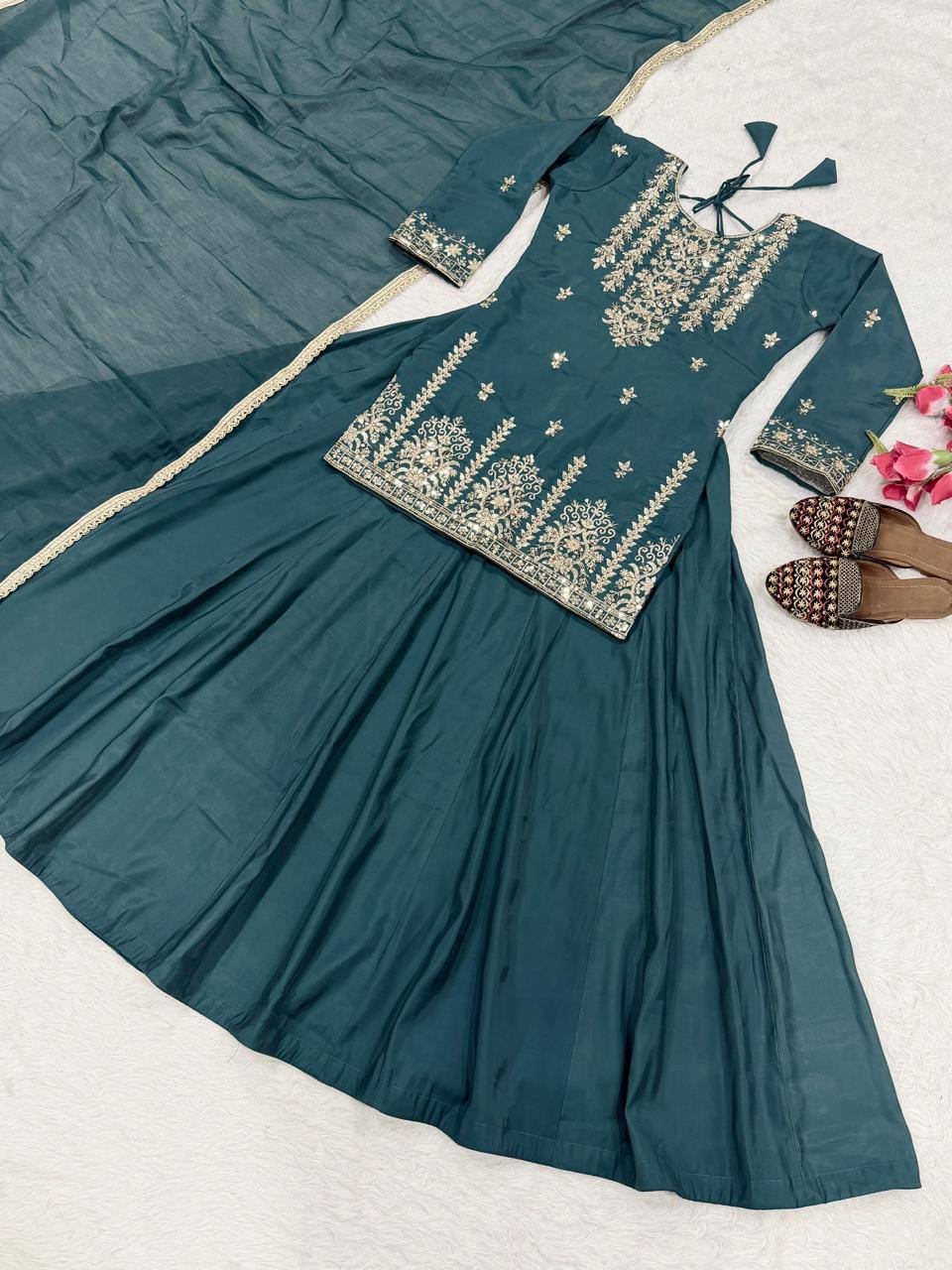 Exquisite Rama Green Peplum Kurti and Flared Skirt Set Adorned with Intricate Gold Zari Embroidery and a Matching Sheer Dupatta